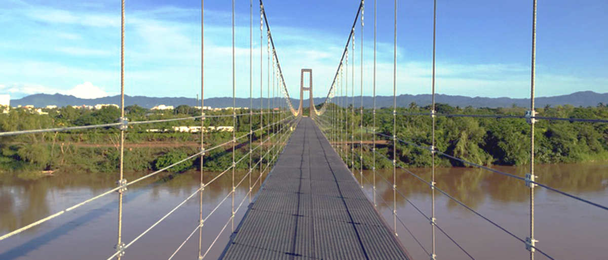 The Greg Norman golf course at Grupo Vidanta's Nuevo Vallarta, Mexico property is on the south side of the Ameca River.  Access is over a newly constructed suspension bridge.  The Greg Norman golf course at Grupo Vidanta's Nuevo Vallarta, Mexico property is scheduled to open on November 15, 2015.  This is a photo of the new bridge.