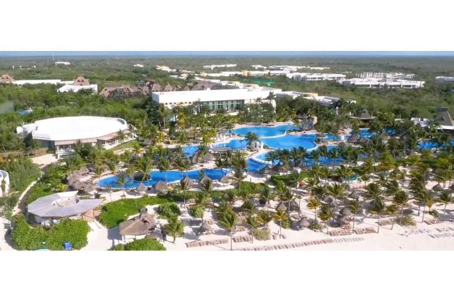 Group Vidanta’s Riviera Maya property has two distinct areas:  The Resort and the Cirque du Soleil theater.  The Luxxe Buildings are located along the southern border of the property.  They are the triangular, three story, flat roofed buildings that appear on the right side of the photo.