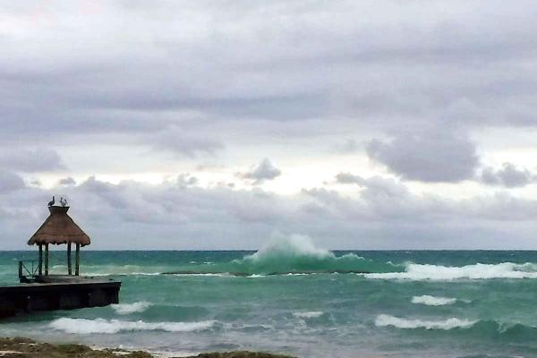 Waves hitting the new breakwater structures placed in the water to improve swimming conditions just off the beach.