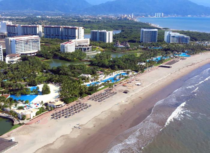 Nuevo Vallarta is a resort area north of Puerto Vallarta, across the Ameca River.  Vidanta's property extends from the mouth of the river, east to Highway 200.  This photo shows the beach side of Vidanta's Nuevo Vallarta property.The Grand Bliss Tower is the first tower on the left side of the photo.  Please tap the photo to enlarge, tap your browser's back arrow to return to this page.