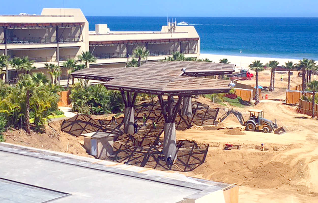 This view shows the construction from behind the fence that separates the pool area from the construction.  The photos of the beach and pool were taken from the area in the distance.