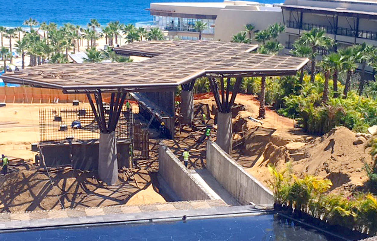 This view shows the construction from behind the fence that separates the pool area from the construction.  The new sun shields are up and the area is starting to take shape.  Review the photo of the map at the top of this page to get a sense of the new appearance.