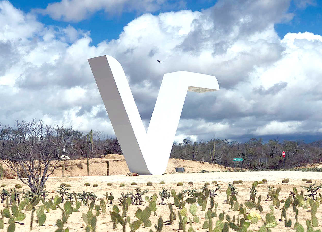 The Vidanta symbol is a giant V at the entrance to the property.  You can't miss it.  Please tap the photo to expand, then tap the browser's back arrow to return to this page.